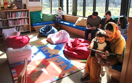 picture of child reading with the mother