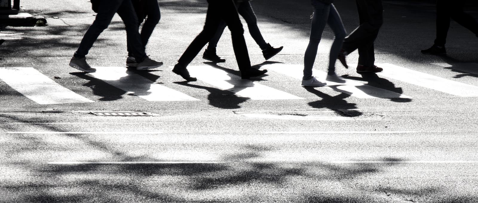 image of shadowy figures walking in group