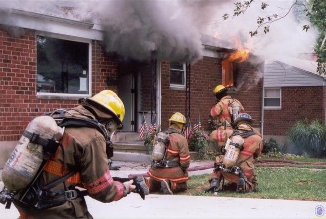 John Beuerle photo infront of burning building