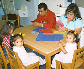 Photo of father, mother and children enjoying a family get together