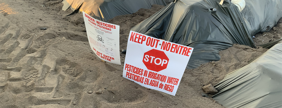 Example of a good keep out sign post next to crop field