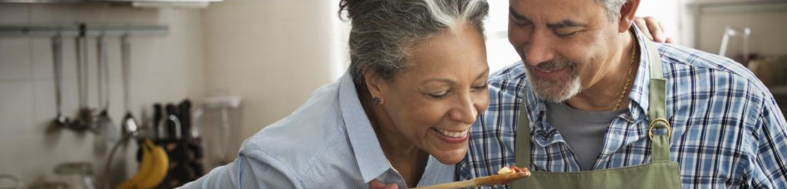 Healthy aging banner image showing two people siting and talking 