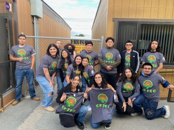 Group of teens holding T-Shirts