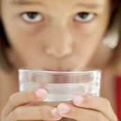 Girl drinking water - CDC