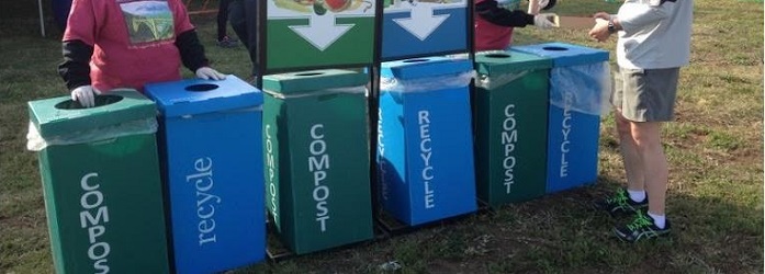 recyling bins lined up at an event